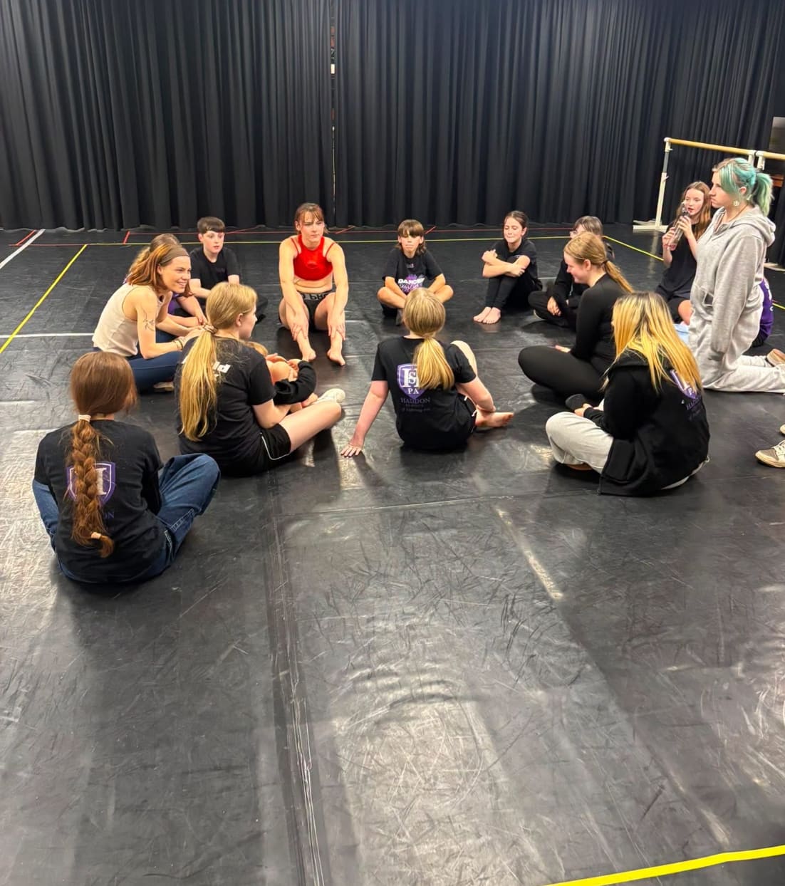 Young people taking part in a performing arts workshop